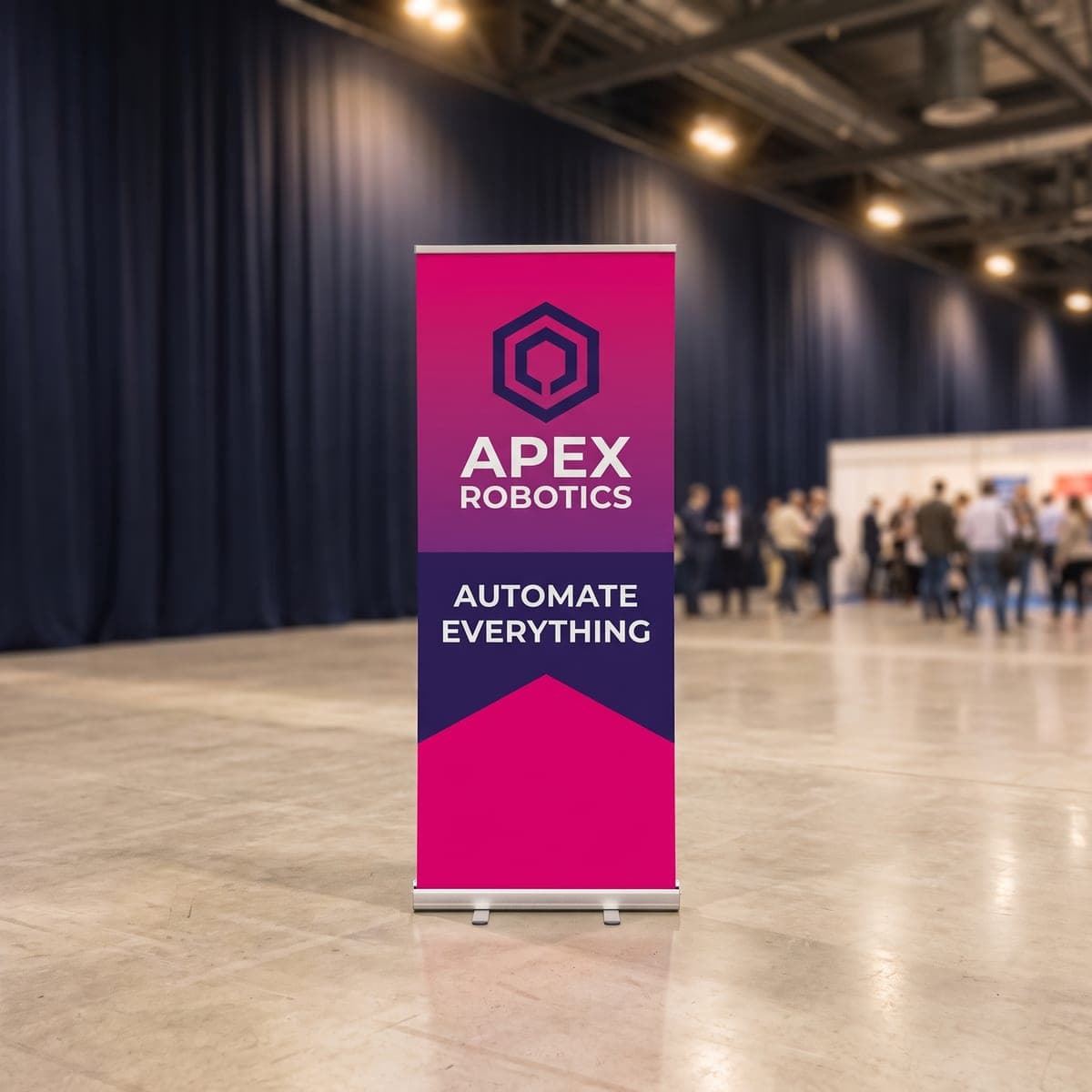 The finished Apex Robotics retractable banner stand set up on polished concrete at a trade show