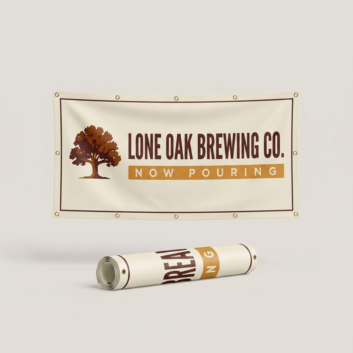 Cream Lone Oak Brewing Co. vinyl banner with an oak tree logo and a gold Now Pouring bar, hanging above a rolled banner in a studio