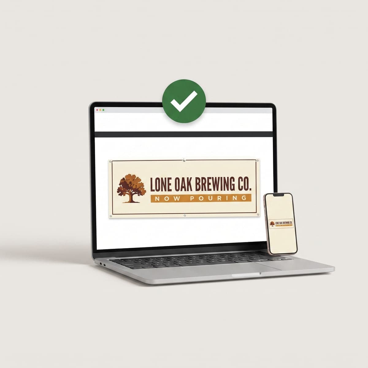Laptop and phone showing the Lone Oak Brewing Co. banner proof with a green approval check