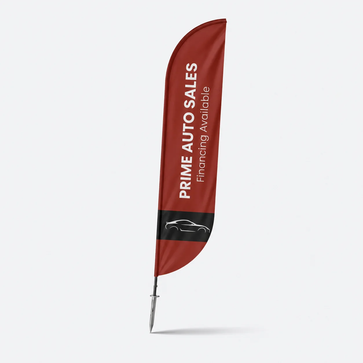 Maroon convex feather flag with white vertical lettering and a curved fly edge, on a ground spike, studio view
