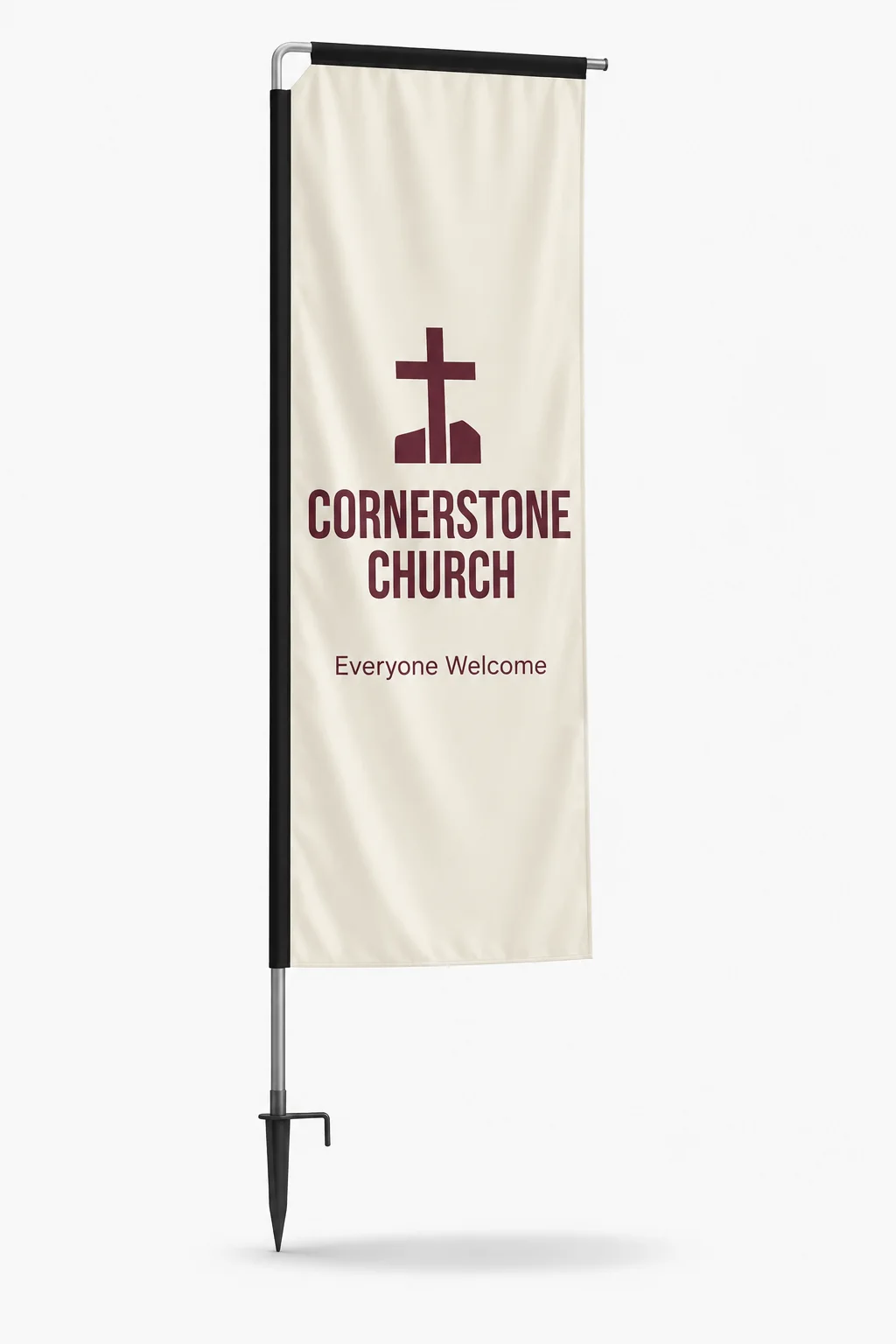Cream rectangle flag with a maroon cross and lettering, on a ground spike with a black top rail, studio view
