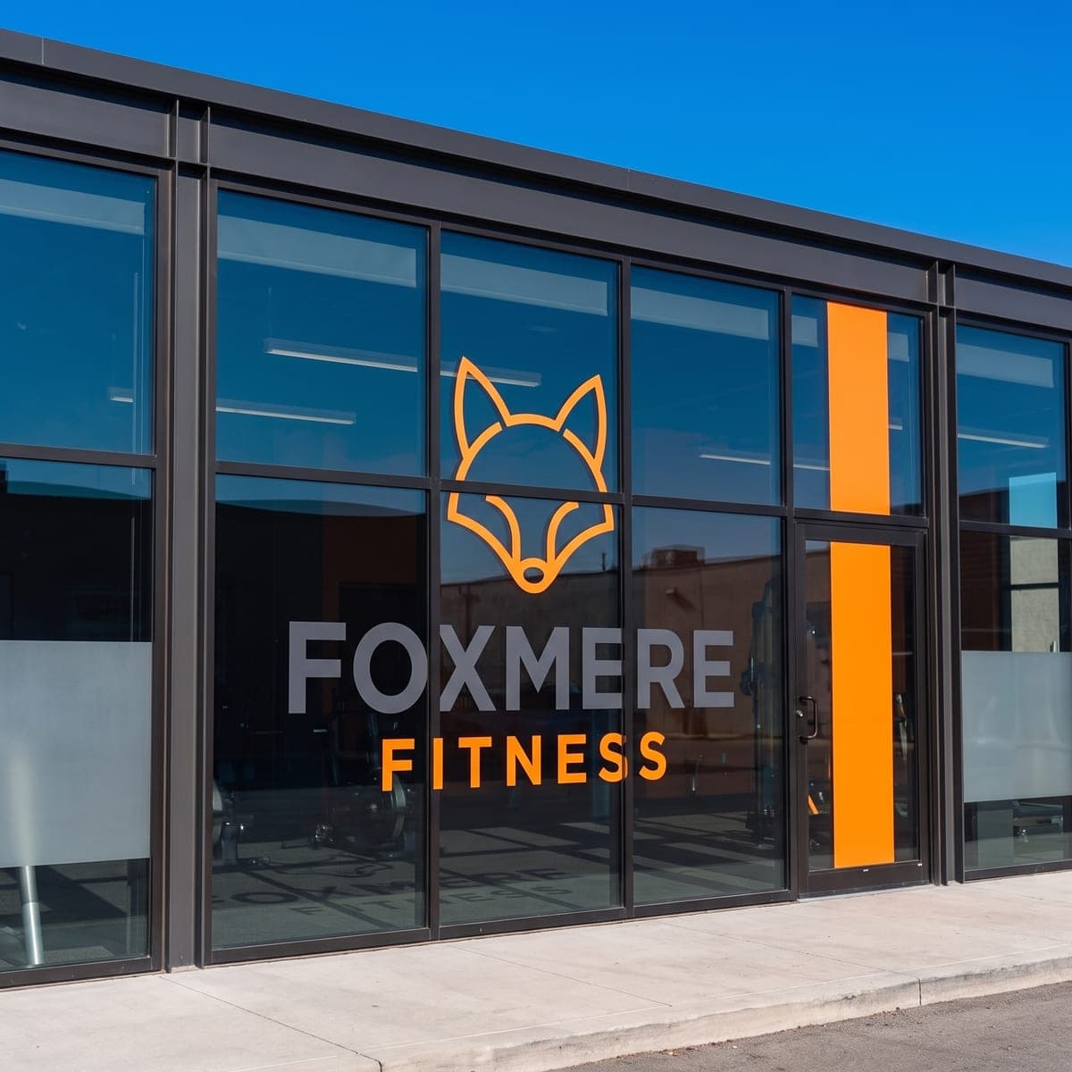 The finished Foxmere Fitness vinyl graphics applied to the storefront glass