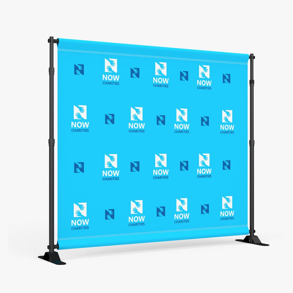 Step-and-repeat backdrop with repeating logo pattern on a display frame