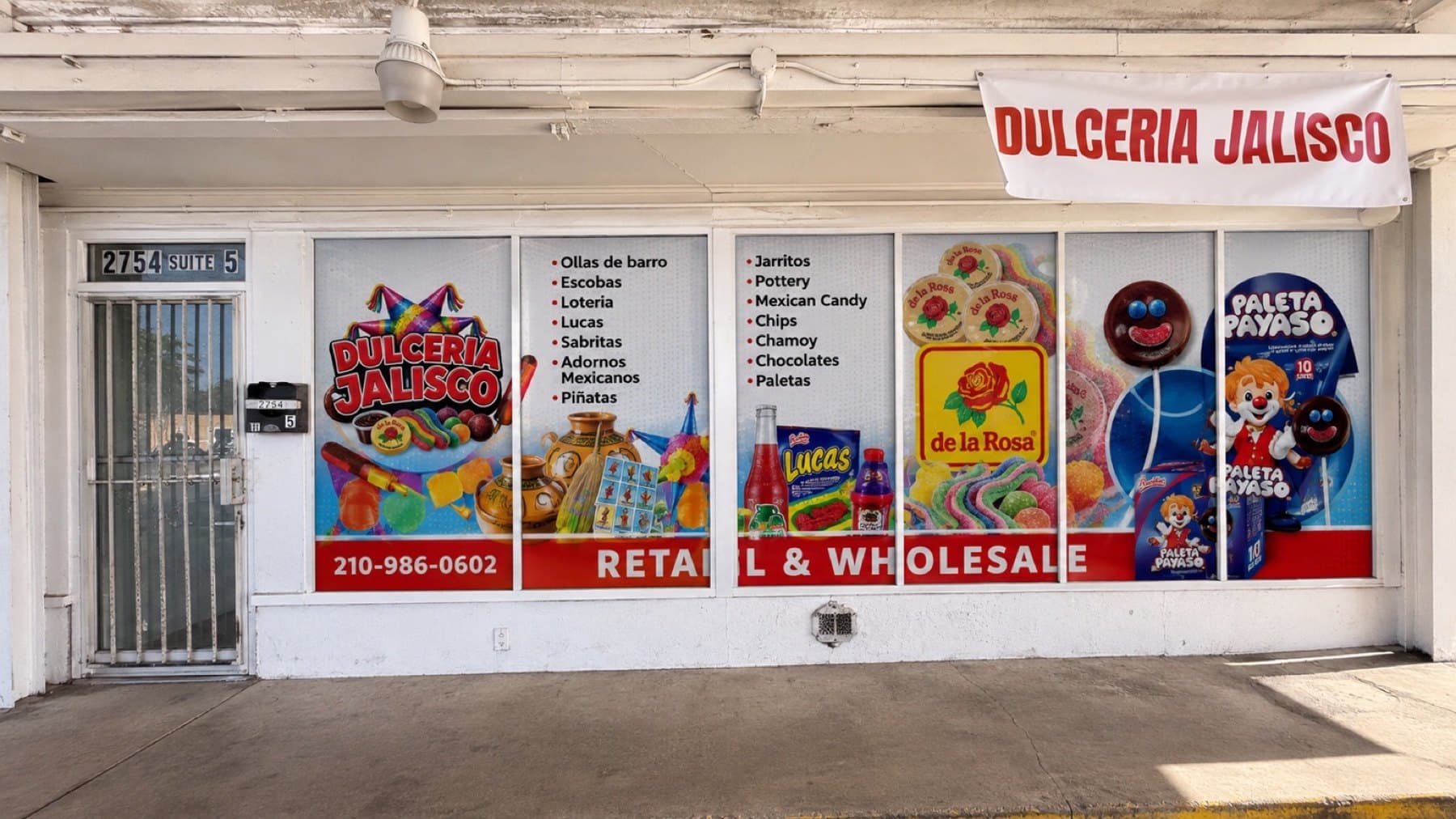 On-site photo of the Dulceria Jalisco storefront after the window graphics went up