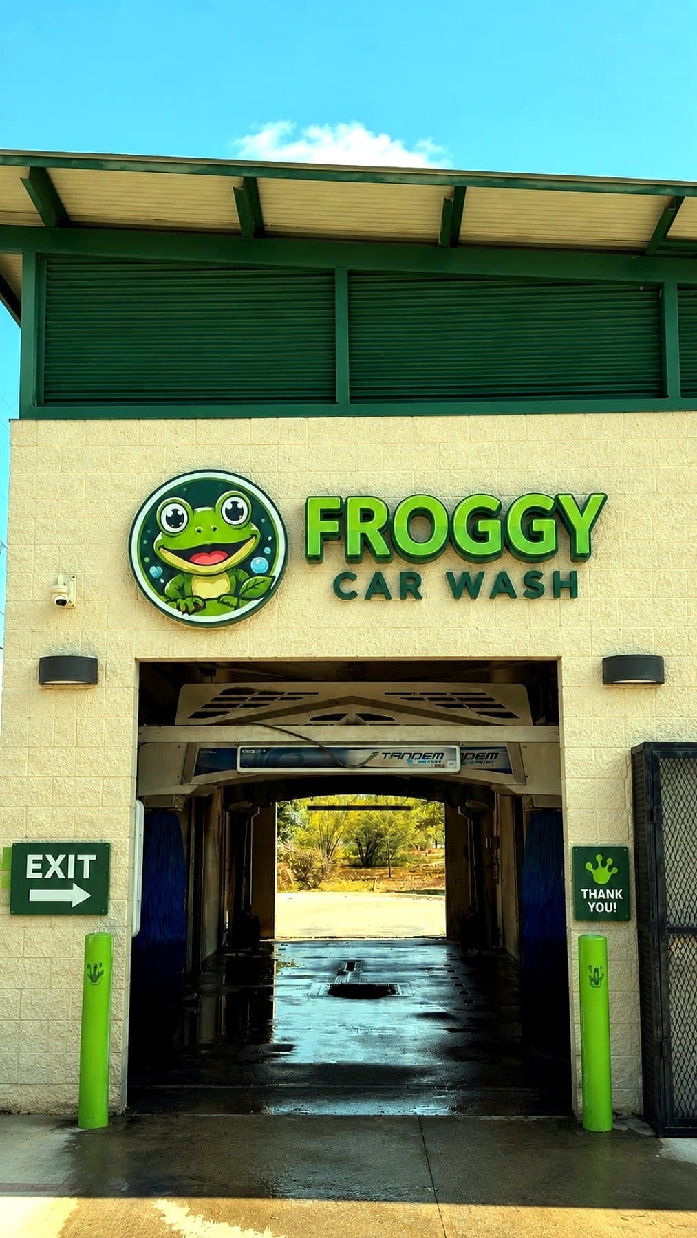 Install-day photo of the Froggy Car Wash letters and logo above the tunnel entrance, taken on site