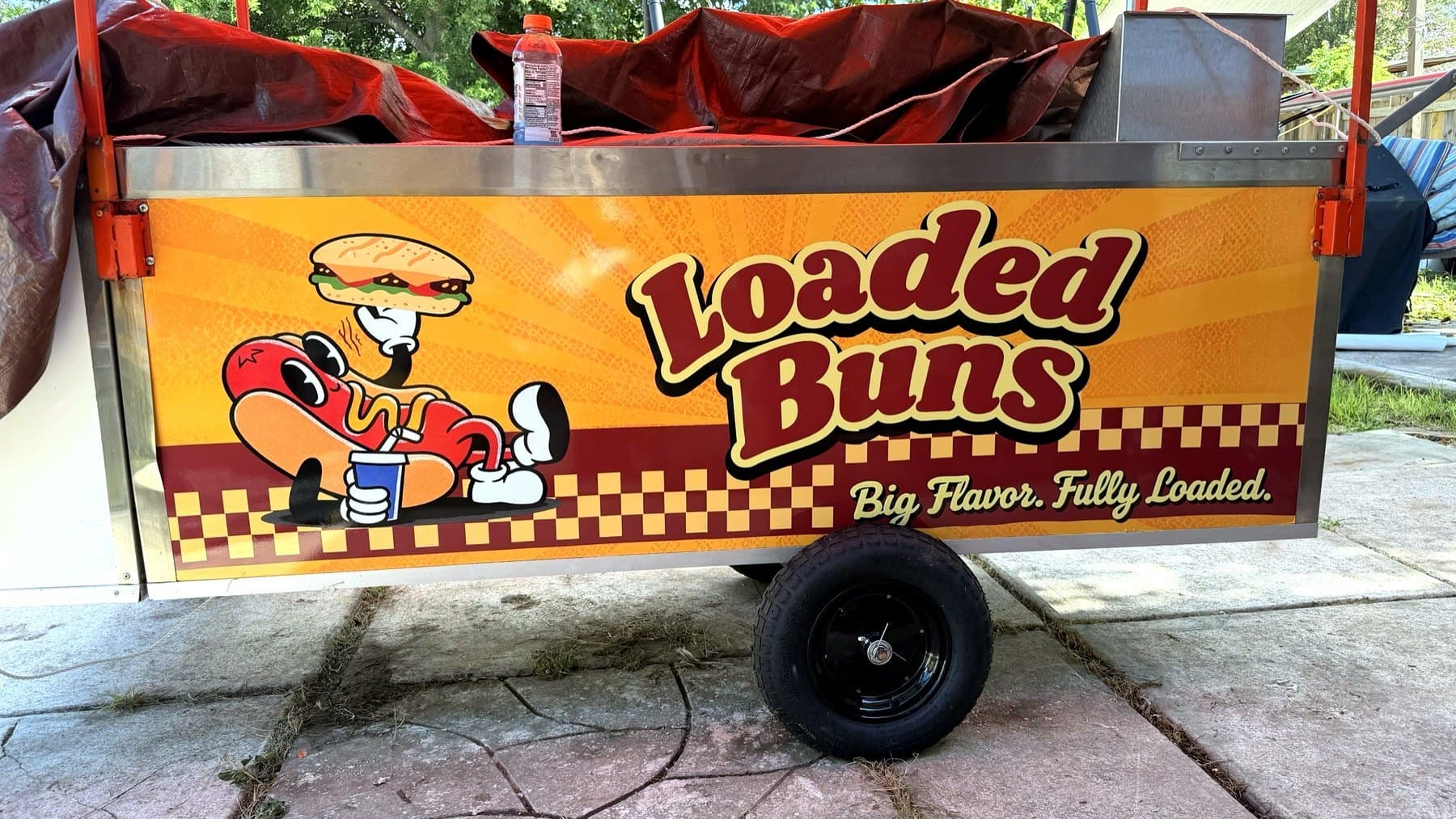 On-site photo of the Loaded Buns cart side panel after the graphics went on