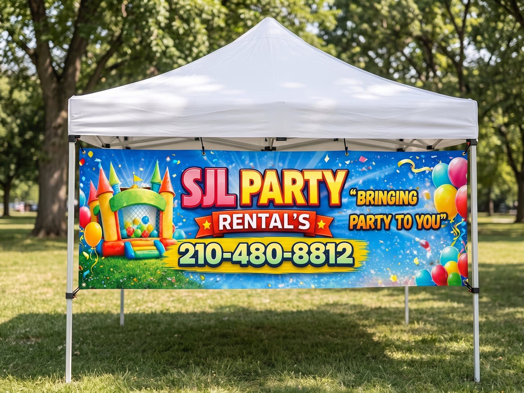 SJL Party Rentals banner stretched across the front of a white pop-up canopy in a sunny park, with the bounce house illustration, the outlined name lockup and the phone number in a yellow band